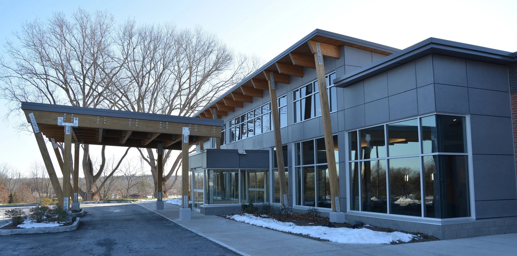 The entrance to our Syracuse office, with the timber canopy framing the front doors